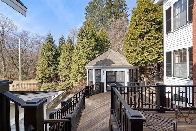 wooden terrace featuring an outdoor structure