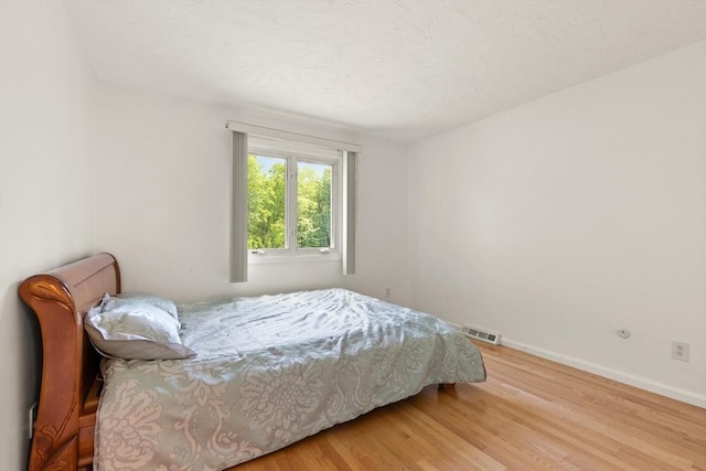 12 Queens Cir, Sharon, MA 02067 - bedroom featuring wood finished floors and baseboards