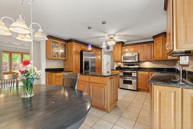 12 Queens Cir, Sharon, MA 02067 - kitchen with appliances with stainless steel finishes, a sink, light tile patterned floors, backsplash, and ceiling fan