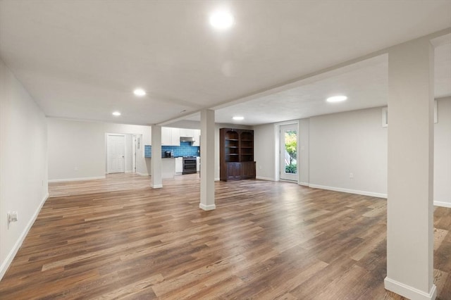 12 Queens Cir, Sharon, MA 02067 - below grade area with light wood-style flooring, baseboards, and recessed lighting