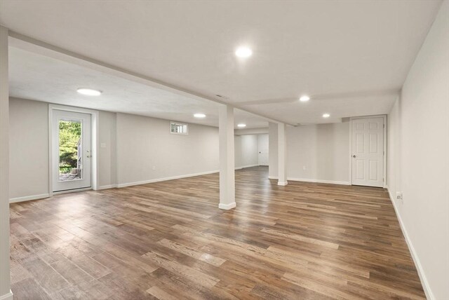 12 Queens Cir, Sharon, MA 02067 - below grade area with wood finished floors, recessed lighting, and baseboards