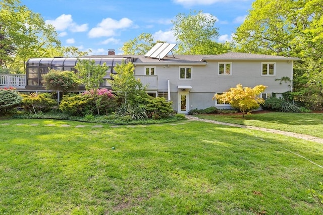 12 Queens Cir, Sharon, MA 02067 - back of property featuring a lawn and a chimney