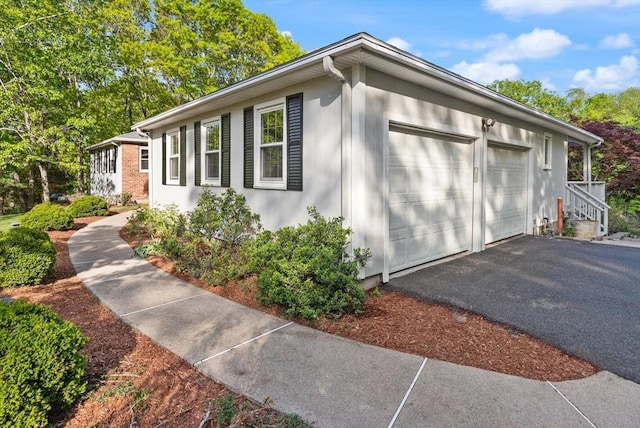 12 Queens Cir, Sharon, MA 02067 - view of property exterior featuring a garage