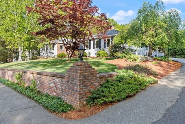12 Queens Cir, Sharon, MA 02067 - view of property hidden behind natural elements with a front lawn