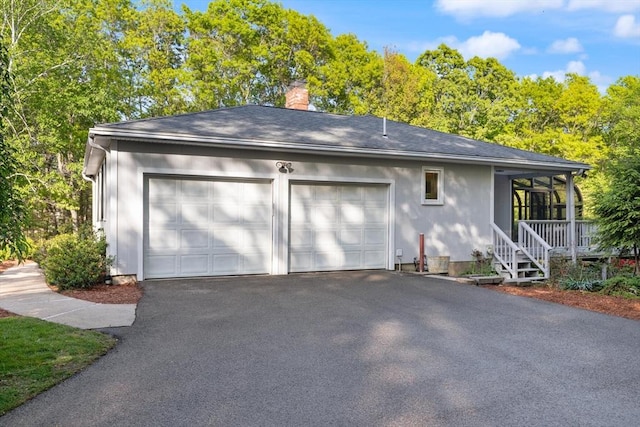 12 Queens Cir, Sharon, MA 02067 - garage featuring asphalt driveway