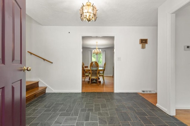 12 Queens Cir, Sharon, MA 02067 - entryway featuring a chandelier, baseboards, and stairs