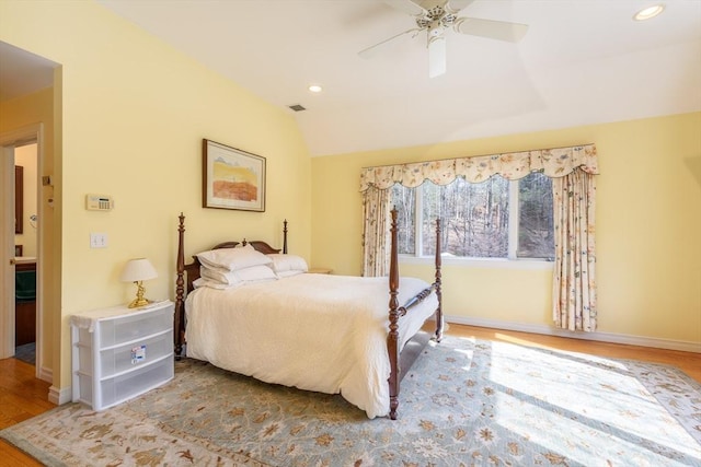 bedroom with recessed lighting, baseboards, wood finished floors, and vaulted ceiling