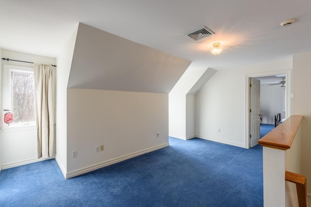 bonus room with visible vents, baseboards, carpet, and lofted ceiling