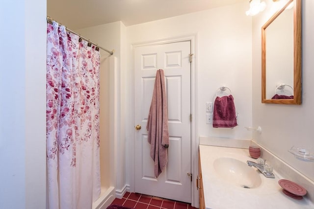 bathroom with vanity, a shower with curtain, and tile patterned flooring