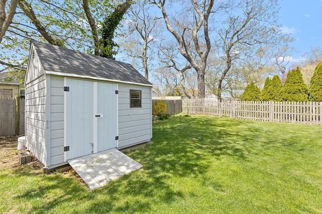 view of shed featuring a fenced backyard