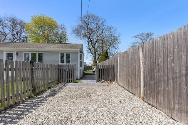view of side of home featuring fence private yard