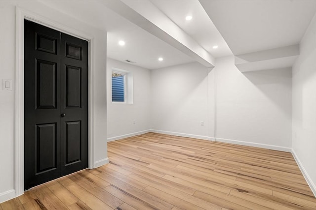 basement featuring light wood-type flooring