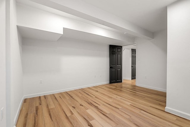 spare room featuring light wood-type flooring