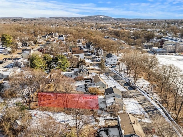 birds eye view of property with a mountain view