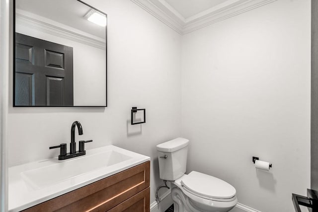 bathroom featuring ornamental molding, toilet, and vanity