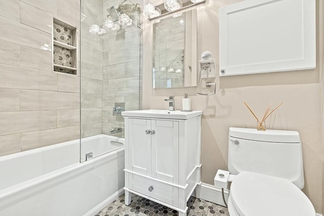 271 Dartmouth St Unit 5C, Boston, MA 02116 - bathroom with toilet, washtub / shower combination, vanity, and tile patterned flooring