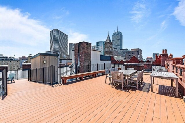 271 Dartmouth St Unit 5C, Boston, MA 02116 - deck with a view of skyline and outdoor dining space