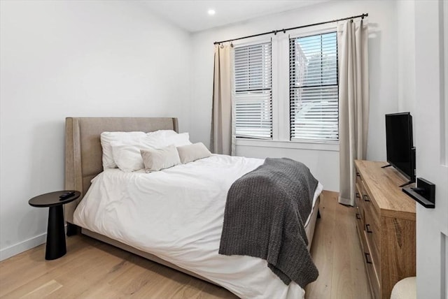 bedroom featuring light wood-type flooring