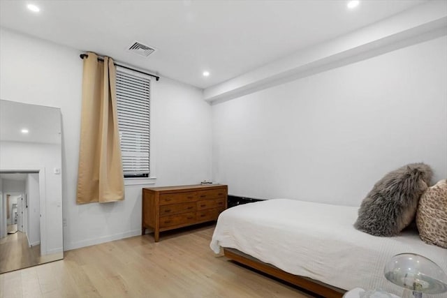 bedroom with light hardwood / wood-style floors