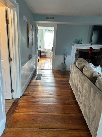 corridor featuring dark hardwood / wood-style flooring