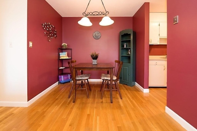 238 Rock St Unit C8, Norwood, MA 02062 - dining space featuring light wood-type flooring and baseboards