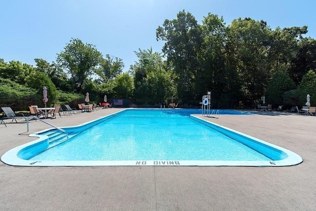 238 Rock St Unit C8, Norwood, MA 02062 - community pool with a patio and view of wooded area
