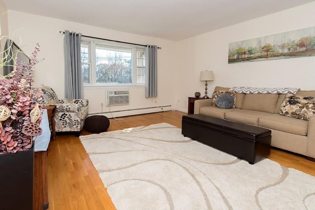238 Rock St Unit C8, Norwood, MA 02062 - living room with wood finished floors, an AC wall unit, and baseboard heating
