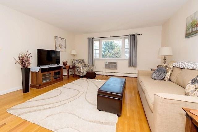 238 Rock St Unit C8, Norwood, MA 02062 - living room featuring wood finished floors, a baseboard radiator, and an AC wall unit