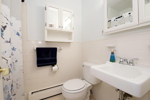 238 Rock St Unit C8, Norwood, MA 02062 - full bathroom with baseboard heating, tile walls, a sink, toilet, and wainscoting