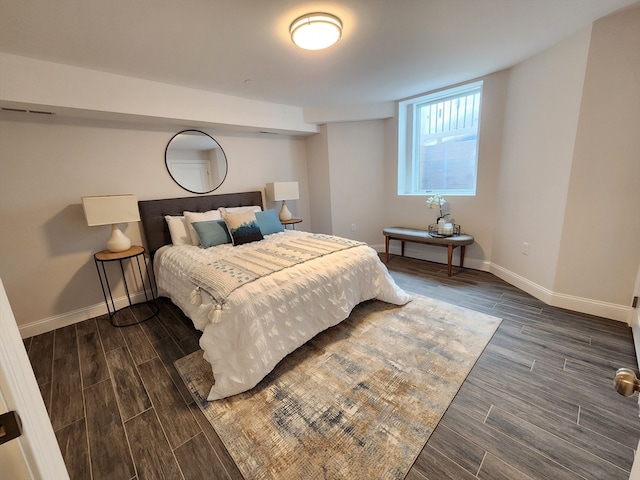 bedroom featuring dark wood-type flooring