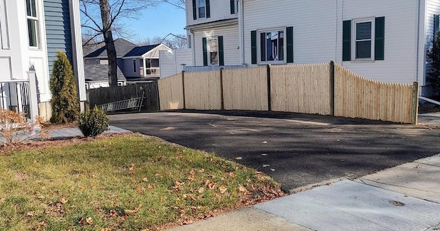 view of property exterior with a yard