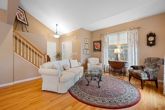 9 Summerfield Dr Unit 8, Grafton, MA 01560 - living area featuring stairs, vaulted ceiling, wood-type flooring, and baseboards