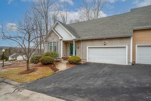 9 Summerfield Dr Unit 8, Grafton, MA 01560 - view of front of house featuring driveway, a shingled roof, and an attached garage