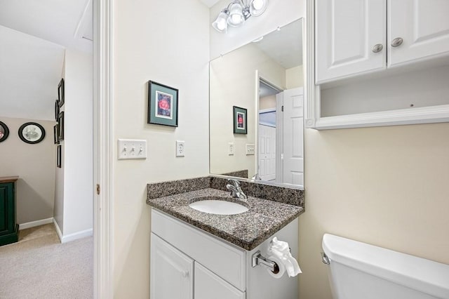 9 Summerfield Dr Unit 8, Grafton, MA 01560 - half bathroom featuring toilet, baseboards, and vanity