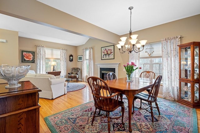 9 Summerfield Dr Unit 8, Grafton, MA 01560 - dining room featuring plenty of natural light, a fireplace, hardwood / wood-style floors, and an inviting chandelier