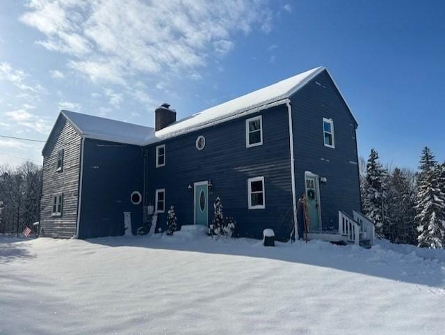 view of snow covered property