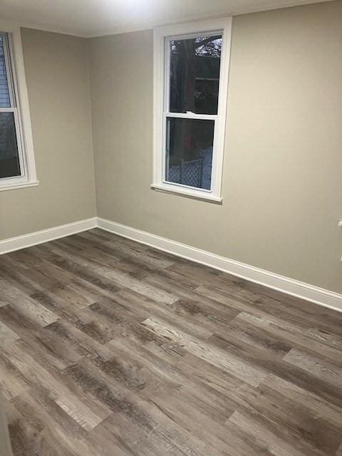 423 Orange St, Springfield, MA 01108 - empty room featuring dark wood-style flooring and baseboards