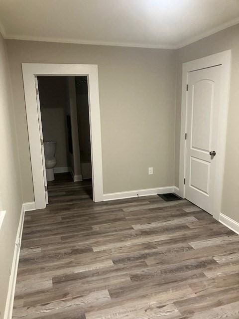 423 Orange St, Springfield, MA 01108 - empty room with wood finished floors, baseboards, and ornamental molding