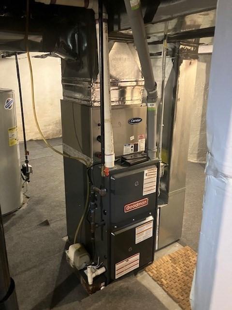 423 Orange St, Springfield, MA 01108 - utility room with water heater and heating unit