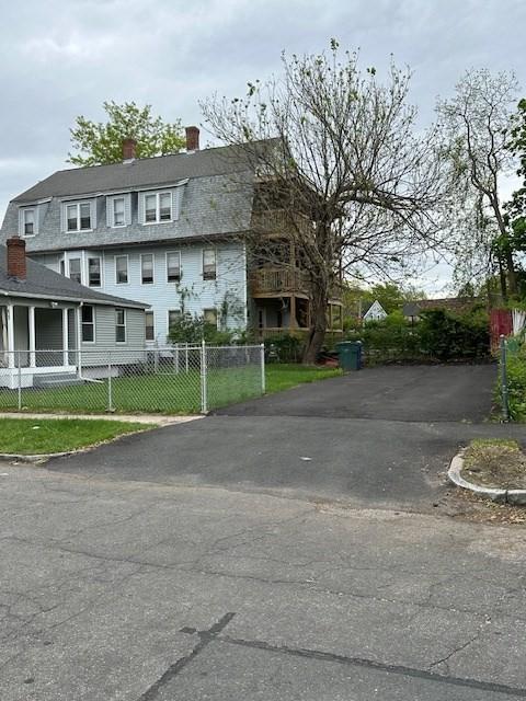 423 Orange St, Springfield, MA 01108 - view of front of house featuring a chimney