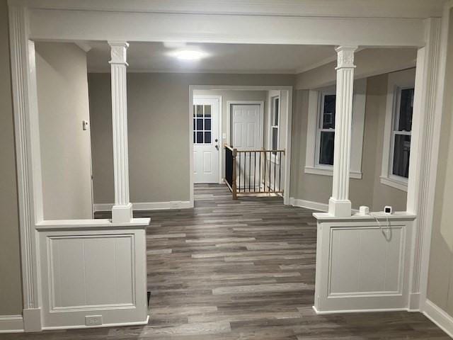423 Orange St, Springfield, MA 01108 - hallway with baseboards, ornate columns, dark wood finished floors, an upstairs landing, and crown molding