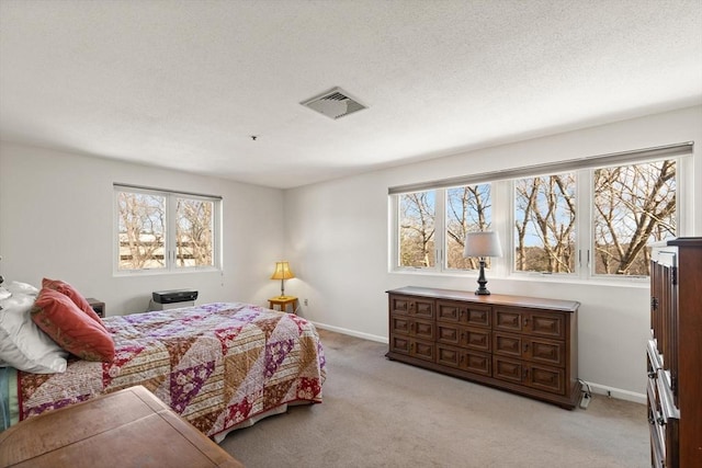 bedroom featuring multiple windows and light carpet