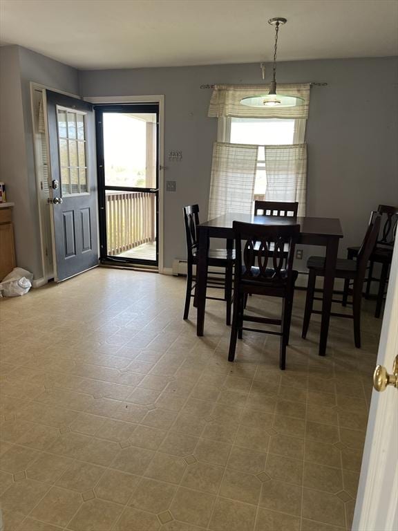 dining area featuring baseboards