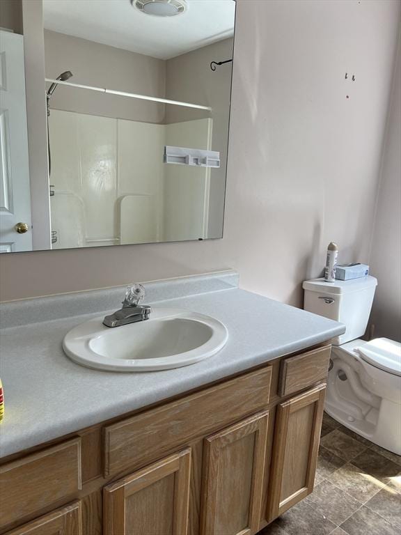 bathroom with vanity and toilet