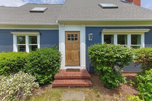 88 Amelia Way, Barnstable, MA 02648 - doorway to property featuring a shingled roof and a chimney