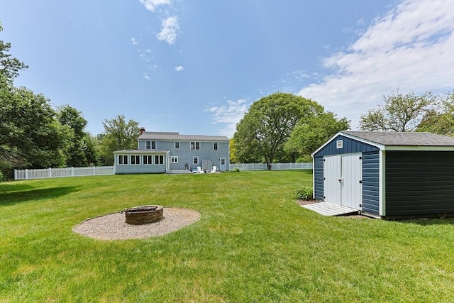 88 Amelia Way, Barnstable, MA 02648 - fenced backyard with a fire pit and a storage shed