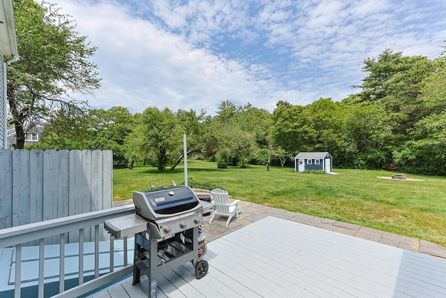 88 Amelia Way, Barnstable, MA 02648 - deck with an outdoor fire pit, a storage shed, a lawn, and grilling area