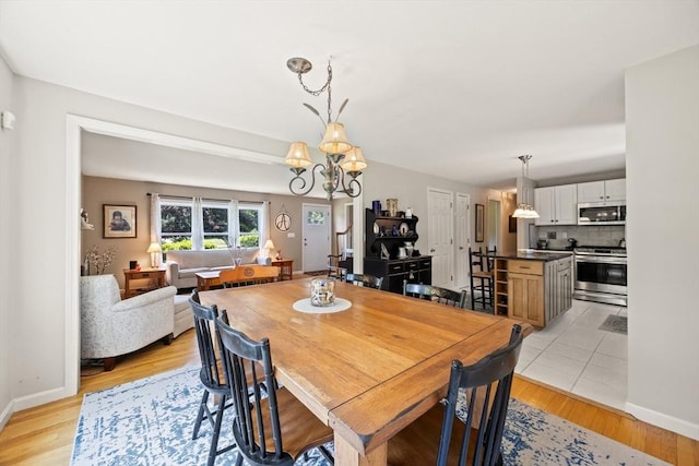 88 Amelia Way, Barnstable, MA 02648 - dining area with a chandelier and light wood-type flooring