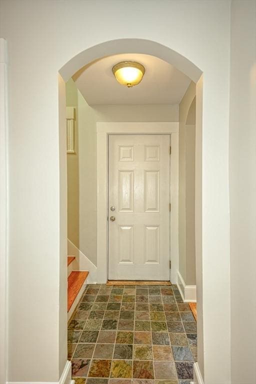 14 Mountain Ave, Marlborough, MA 01752 - entryway with arched walkways, baseboards, dark stone finish floors, and stairs
