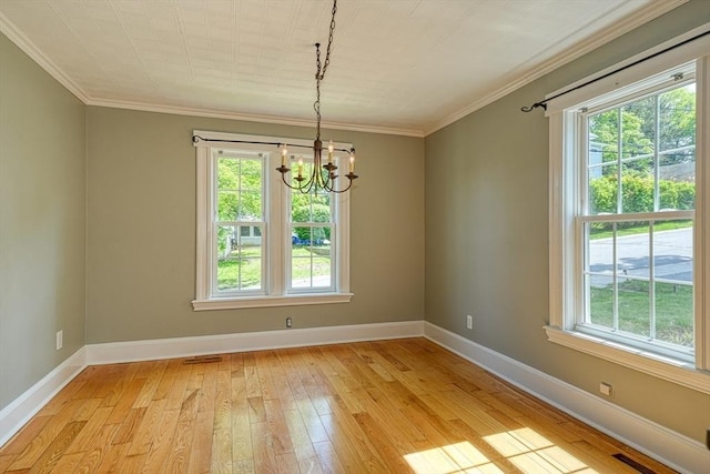 14 Mountain Ave, Marlborough, MA 01752 - unfurnished room featuring plenty of natural light, a chandelier, light wood-style floors, baseboards, and ornamental molding